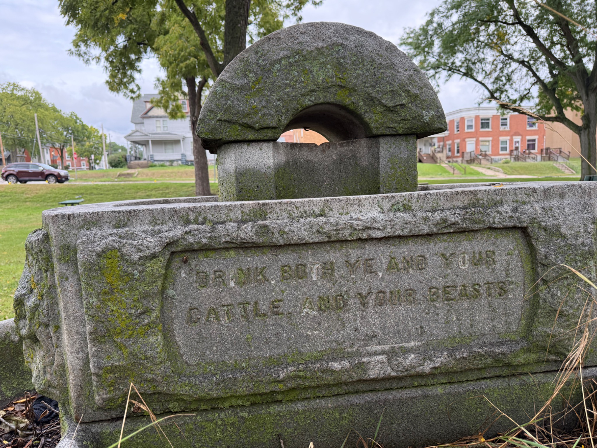 The fountain's inscription reads Drink both ye and your cattle and your beasts