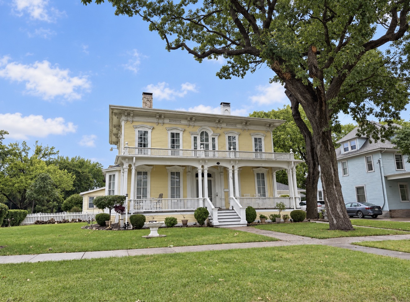 The yellow Italianate Richard Newcomb House at 905 Bushnell Street in Beloit